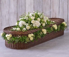 White casket spray and garland