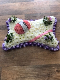 Pillow with wool and knitting needles